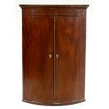 A VICTORIAN INLAID MAHOGANY BOW FRONTED CORNER CUPBOARD, 108 X 77CM