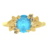 A BLUE ZIRCON AND DIAMOND RING, IN GOLD MARKED 14K, 3.5G, SIZE O, ++ZIRCON ABRADED TO FACET EDGES,
