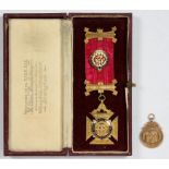 A 9CT GOLD AND ENAMEL R.A.O.B OFFICER'S JEWEL, BIRMINGHAM 1930, CASED AND A GOLD WATCH FOB SHIELD,
