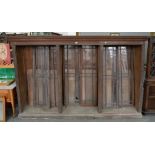 A VICTORIAN OAK ENCLOSED BOOKCASE WITH ADJUSTABLE SHELVES AND THREE PAIRS OF GLAZED DOORS, 183CM H X