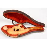 A MEERSCHAUM CHEROOT HOLDER, CARVED WITH A HORSE, AMBER MOUTHPIECE, 10.5CM L, CASED, C1900