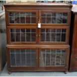 A MAHOGANY SECTIONAL BOOKCASE WITH THREE PAIRS OF LEADED GLASS DOORS, 116 X 89CM