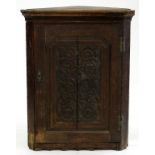 A VICTORIAN CARVED OAK CORNER CUPBOARD, 101CM H; 80CM W