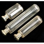 THREE SILVER CAPPED GLASS SCENT BOTTLES, 17, 12.5 AND 9 CM H, EDWARD VII AND LATER, VARIOUS MAKERS