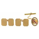 A PAIR OF GOLD CUFFLINKS, CHAIN BACK, STAMPED 9CT AND A RUBY AND GOLD TIE PIN BY PAYTON, PEPPER