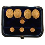 A PAIR OF FOLIATE ENGRAVED GOLD CUFFLINKS, LATE 19TH C, AND MATCHING GOLD DRESS STUDS, CASED, 9G++