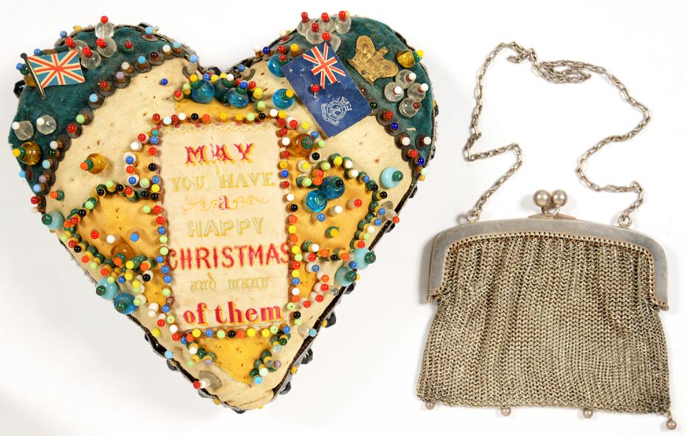 A WORLD WAR ONE VELVET, FELT AND BEADWORK HEART SHAPED SWEETHEART'S PIN CUSHION, 17CM L AND AN