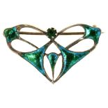 AN ART NOUVEAU SILVER AND TURQUOISE ENAMEL OPENWORK BROOCH SET WITH GREEN PASTE, BY CHARLES