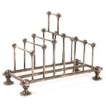 AN EPNS TOAST RACK BASED ON A DESIGN BY DR CHRISTOPHER DRESSER, 13CM H, MAKER RR, LATE 19TH/EARLY