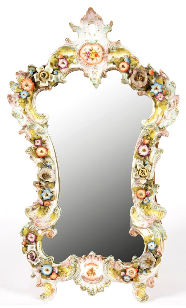 A GERMAN PORCELAIN FLORAL ENCRUSTED EASEL MIRROR OF CARTOUCHE SHAPE, 47CM H, LATE 19TH C