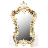 A GERMAN PORCELAIN FLORAL ENCRUSTED EASEL MIRROR OF CARTOUCHE SHAPE, 47CM H, LATE 19TH C