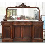 A VICTORIAN MAHOGANY MIRROR BACK SERPENTINE SIDEBOARD, THE BASE FITTED WITH FOUR PANELLED DOORS,