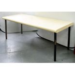A 1970'S LAMINATE DINING TABLE ON FOUR STEEL LEGS, 84 X 213CM, LEGS RUSTED
