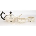 A GEORGE V THREE PIECE SILVER TEA SERVICE, LONDON 1926 AND A PAIR OF EDWARD VII SILVER SUGAR