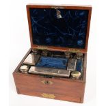 A VICTORIAN WALNUT DRESSING CASE, THE NAVY MOROCCO AND PLUSH FITTED INTERIOR WITH CONTEMPORARY