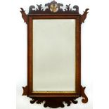 A VICTORIAN WALNUT FRET FRAMED MIRROR WITH BEVELLED PLATE, 69 X 41CM