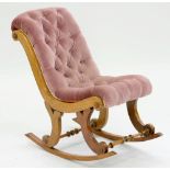 A VICTORIAN WALNUT CHILD'S ROCKING CHAIR, ONE LEG A MAHOGANY REPLACEMENT; WORMED