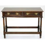 AN OAK SIDE TABLE WITH TWO GEOMETRIC MOULDED DRAWERS TO THE FRIEZE, ON TURNED LEGS UNITED BY