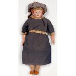 A BISQUE MOULDED SHOULDER HEADED CHARACTER DOLL, PADDED BODY AND COMPOSITION FORE LIMBS,