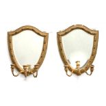 A PAIR OF VICTORIAN SHIELD SHAPED GILTWOOD AND COMPOSITION GIRANDOLE WITH THREE BEADED SCONCES ON