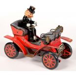 A 1960'S BATTERY OPERATED TINPLATE VETERAN MOTOR CAR AND DRIVER