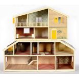 A "CAROLINE'S HOME" COMPOSITE DOLLS HOUSE AND A SECTION OF A SIMILAR COMPOSITE DOLLS HOUSE, 78CM