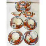 A JAPANESE SAMURAI CHINA FLORAL TEA SERVICE WITH ORANGE, BLUE AND GREEN BANDED GROUND, SECOND