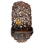 A JAPANESE CARVED AND LACQUERED WOOD BRACKET SHELF, THE PIERCED WALL PLATE WITH BIRDS AND FLOWERS