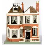 A VICTORIAN STYLE BAY FRONTED DOLLS HOUSE, 83CM H; 65 X 47CM