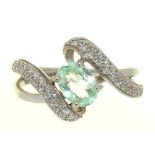 A PALE GREEN TOURMALINE AND PAVE DIAMOND RING, IN 18CT WHITE GOLD, MAKER R&C, 4.5G, SIZE O++IN