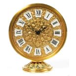 A JAEGER ORNATE ROUND GILT BRASS AND FILIGREE ALARM TIMEPIECE ON FLARED FOOT, 9.5CM H, C1960