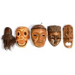 TRIBAL ART. FIVE VARIOUS CARVED WOOD MASKS, ONE WITH FIBRE WHISKERS, 34CM H AND SMALLER, 20TH C