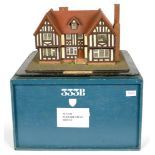 A PAINTED WOOD MODEL OF AN ELIZABETHAN HOUSE, ON WOOD BASE, 46CM L, IN PAINTED WOOD TRAVELLING CASE