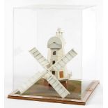 A PAINTED WOOD MODEL OF AN ENGLISH SMOCK WINDMILL, APPROXIMATELY 46CM H, IN ACRYLIC DISPLAY CASE