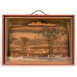 A WOODEN FRETSAWN SCULPTURE OF THE SAVANNA GRASSLANDS, IN GLAZED WOOD DISPLAY CASE, 60CM L AND