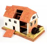 A CARVED AND PAINTED WOOD MODEL OF AN ENGLISH WATER MILL, 45CM L