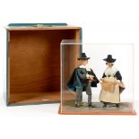 A PAIR OF COSTUME DOLLS OF AN ENGLISH PURITAN COUPLE, 34CM H, IN ACRYLIC DISPLAY CASE AND PAINTED