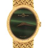 A BAUME AND MERCIER 18CT GOLD LADY'S WRISTWATCH, 18CT GOLD WOVEN BRACELET, 21 MM OVAL DIAL, NUMBERED