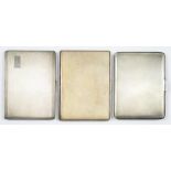 THREE SILVER CIGARETTE CASES, LARGEST 11.5 X 8.5 CM, GEORGE VI AND LATER, 16OZS 6DWTS++TARNISHED.