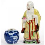 A CHINESE FAMILLE ROSE FIGURE OF SHOU LAO, 27CM H AND A CHINESE BLUE AND WHITE PRUNUS GINGER JAR