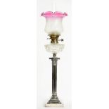 A PLATED BRASS CORINTHIAN COLUMN OIL LAMP ON STEPPED SQUARE FOOT WITH CUT GLASS FOUNT, MESSENGER