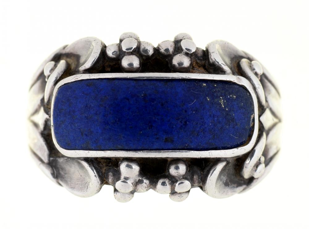 GEORG JENSEN. A LAPIS LAZULI RING IN SILVER, MARKED NO.76, C1930, 12G, SIZE S½++IN GOOD CONDITION,