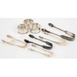 MISCELLANEOUS SILVER SUGAR TONGS AND NAPKIN RINGS, VICTORIAN AND LATER, 7OZS 4DWTS++TARNISHED