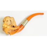 A MEERSCHAUM TOBACCO PIPE CARVED AS THE HEAD OF A DOG AND PARTRIDGE, SILVER MOUNTED AMBER