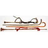 A COPPER AND BRASS HUNTING HORN, AN ANTLER HANDLED LEATHER WHIP, ANOTHER HORN AND TWO WALKING STICKS
