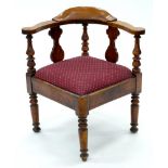 A VICTORIAN FRUITWOOD CORNER CHAIR ON TURNED LEGS