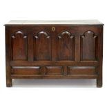AN 18TH C OAK MULE CHEST WITH FOUR RAISED AND FIELDED BREAK ARCHED PANELS AND BOARDED LID, 86CM H;