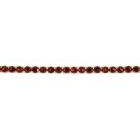 A FACETED GARNET BRACELET IN 9CT GOLD, 13G++IN GOOD CONDITION