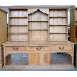 A LATE VICTORIAN WAXED PINE DRESSER, THE BASE FITTED WITH BOARDED TOP, 108CM H; 227 X 67CM