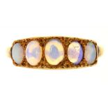 A FIVE STONE OPAL RING, IN GOLD MARKED 18CT, 2.5G, SIZE N½++MIDDLE OPAL IS CHIPPED